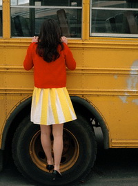 Woman Looking into School Bus
